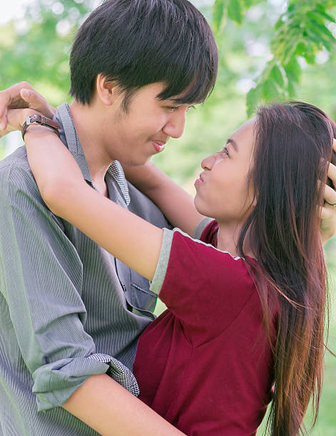 istock asia young couple in love park 483873970