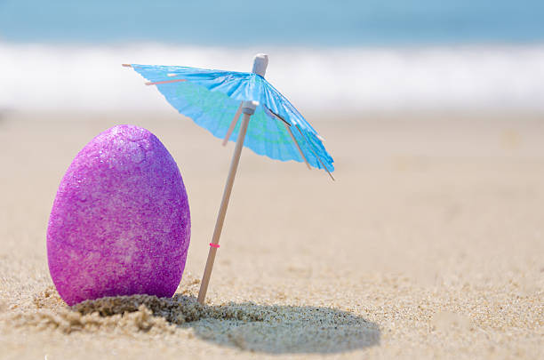 Easter egg on the beach stock photo