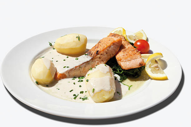 istock Close up of fried salmon with spinach,boiled potatoes 483874824