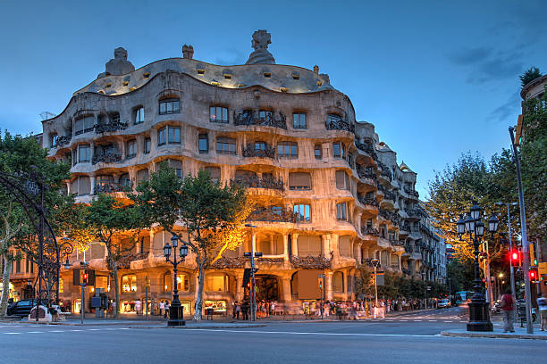 Casa Mila, Barcelona, Spain Barcelona, Spain - July 28, 2012: Twilight scene of Casa Mila (La Pedrera) in Eixample, Barcelona on July 28, 2012. Casa Mila an apartment building, is one of Antoni Gaudi's most famous works. casa stock pictures, royalty-free photos & images