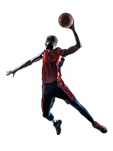 african man basketball player jumping dunking silhouette one african man basketball player jumping dunking in silhouette white background basketball player photos stock pictures, royalty-free photos & images