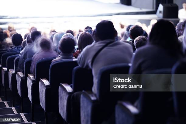 Audience Sitting In Tiered Seating Stock Photo - Download Image Now - Movie Theater, Audience, Blurred Motion