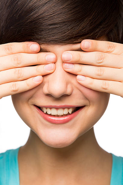 istock Mexican girl covering her eyes with her hands 483878562