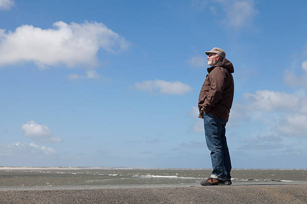 istock Germany, Wangerooge, North Sea, one man on dyke 483879066