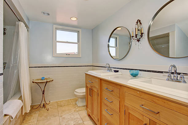 istock Modern bathroom with two oval mirrors, and white shower curtain. 483879276