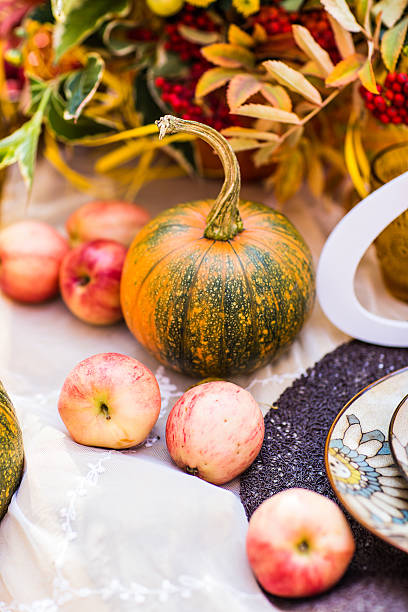 istock pumpkins and autumn leaves 483879476