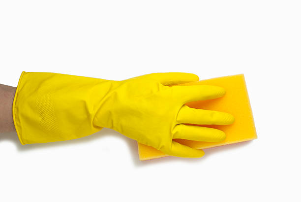 istock hand in yellow glove 483883974