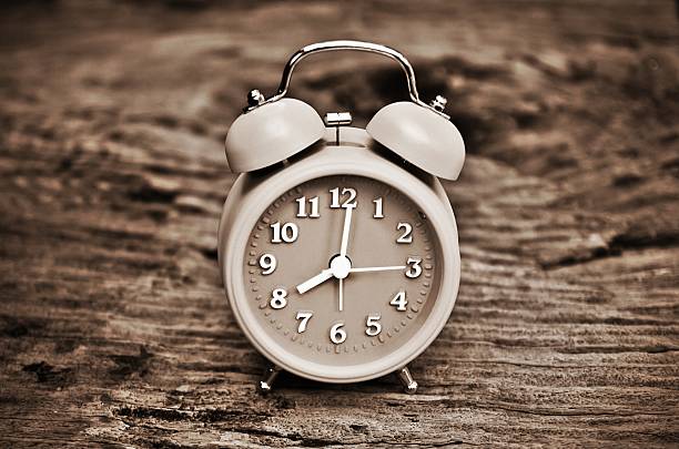 istock Black and white photo of old alarm clock. 483889264