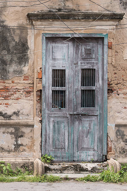 istock antique wood door and brick wall 483890180