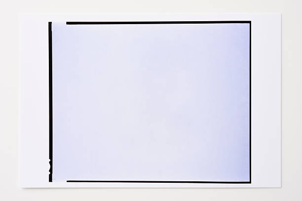 istock Photographic paper with blank photo frame on white background 483893602