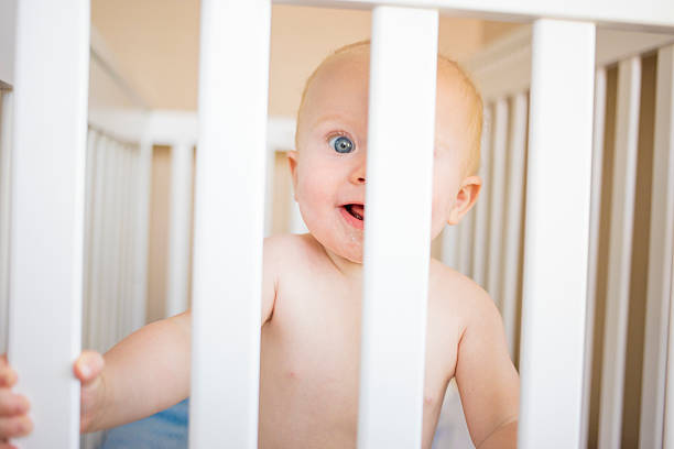 istock Baby boy in his crib 483893610