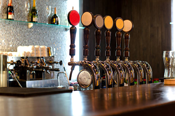 istock Beer taps behind a bar counter 483894088