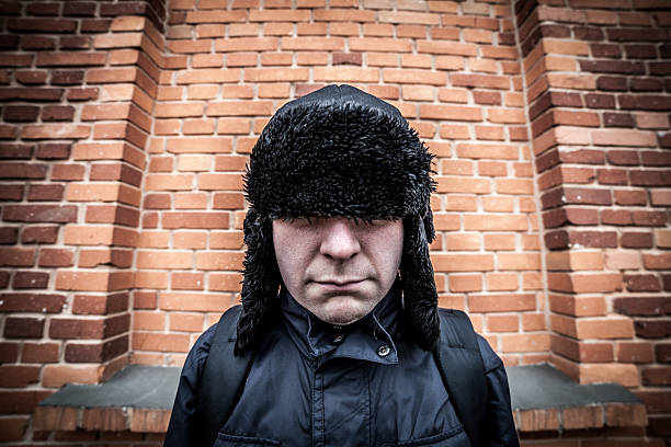 istock Funny disappointed shy man hiding in his cap 483895228