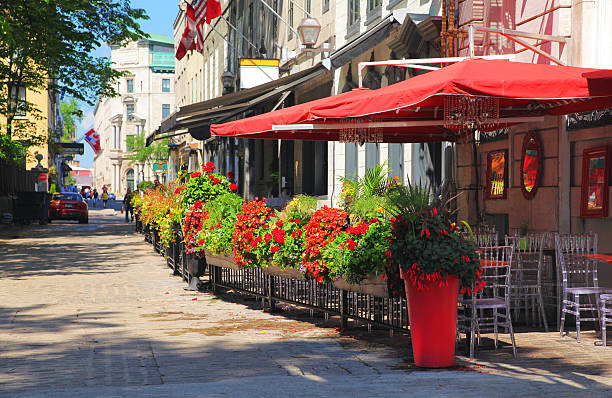 StreetSide Bistro Small Street Side Bistro in Old Quebec City during Summer buzbuzzer quebec city stock pictures, royalty-free photos & images