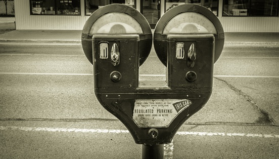 Vintage parking meter in an urban setting.