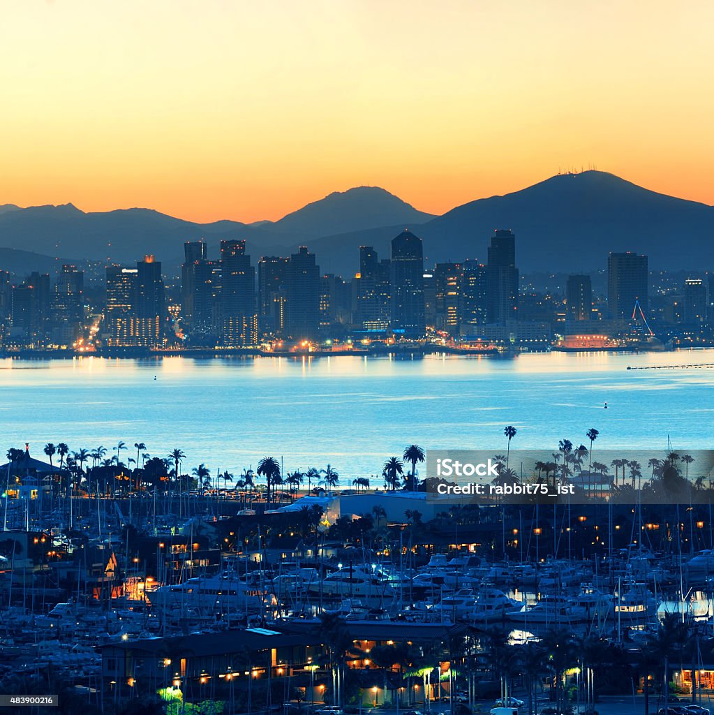 San Diego downtown San Diego downtown skyline at sunrise with boat in harbor. 2015 Stock Photo