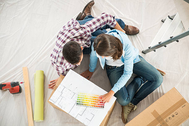 istock couple in new home choosing wall paint colors 483905164