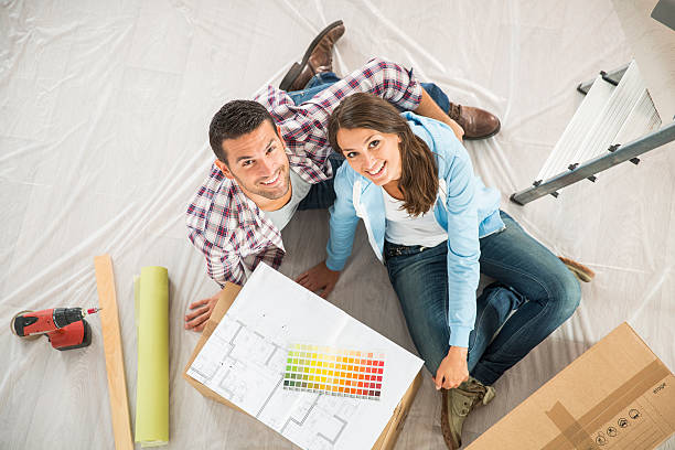 istock couple in new home choosing wall paint colors 483905168