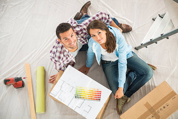 istock couple in new home choosing wall paint colors 483905170