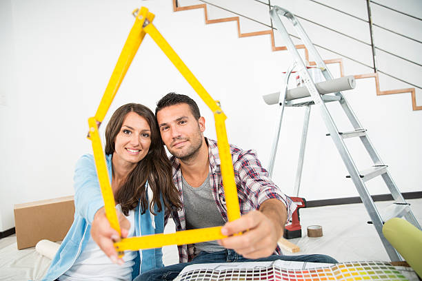 istock couple in new home choosing wall paint colors 483905172