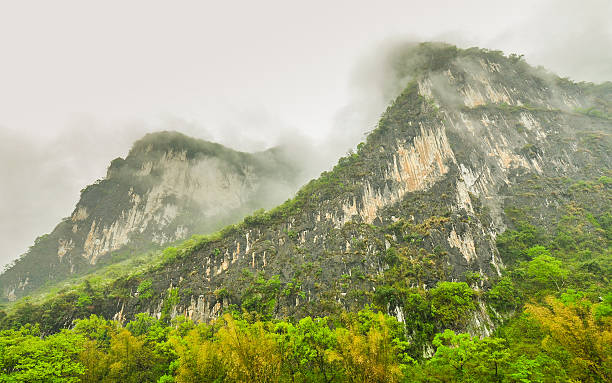 istock Cloud-shrouded Karsts Mountains by the Li River, Guilin, China 483905966