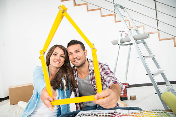 istock couple in new home choosing wall paint colors 483906150
