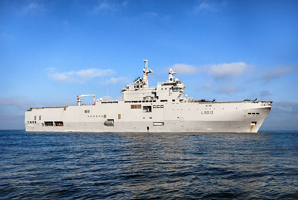 BPC Mistral Toulon, France - January 24, 2012: The Sevastopol mistral warship BPC (Projection Building and Commandment) is on its way for its first sea trials, on the military port of Toulon. French President Francois Hollande said last February conditions were 'still not right' to go ahead with the sale of the Mistral warship to Russia despite Moscow having backed a new Ukraine peace plan. Hollande suspended the 1.2 billion euros ($1.5 billion) sale last year as the Ukraine crisis deepened, fearing it would boost Russia's military capabilities and put Paris in hot water with its allies mistral wind stock pictures, royalty-free photos & images