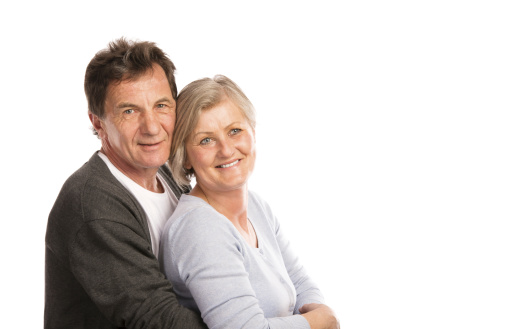 A senior couple on white background.