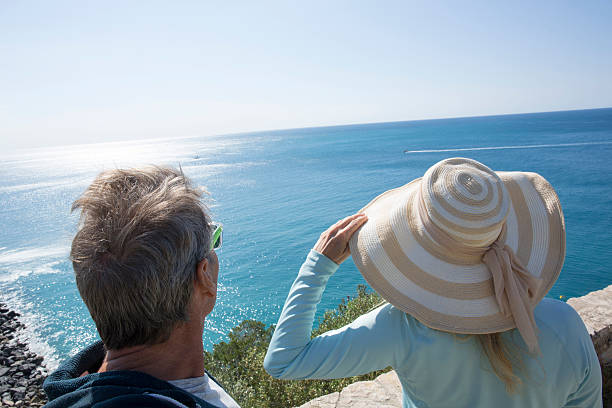 istock Couple look out over Mediterranean coastline 483913644