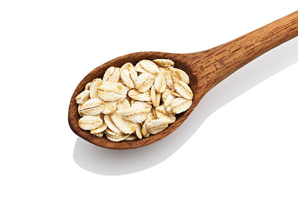 istock Rolled Oats Flakes in Wooden Spoon 483913961