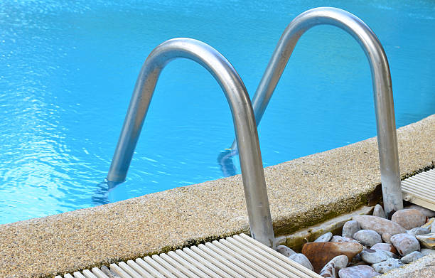 istock Swimming pool with stair at hotel in Thailand 483914435