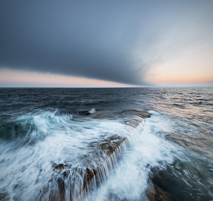 A narrow shoal points to a fog bank off the Atlantic coast of Nova Scotia.