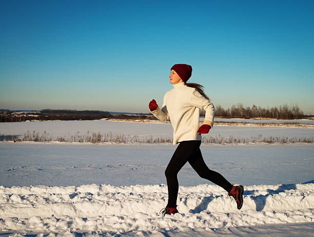 istock Young girl runner. Winter nature. 483916033