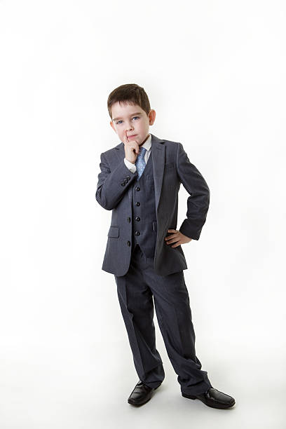 istock young kid dressed up as a business person 483916689