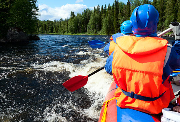 White water rafting Rafters in a rafting boat on Pistojoki river in Karelia, Russia republic of karelia russia stock pictures, royalty-free photos & images