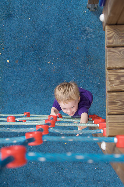 istock Great Copy Space as Child Begins Climbing Playground Rope Ladder 483918043