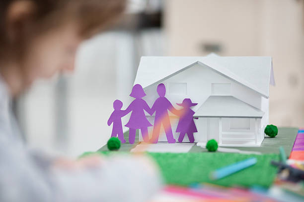 istock Child Making And Coloring Paper Dolls. 483918247