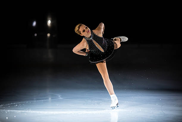 Young female figure skater performing
