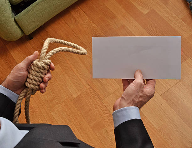 The business suicide. Hangman holding a white chart and letter message. wrongful death stock pictures, royalty-free photos & images