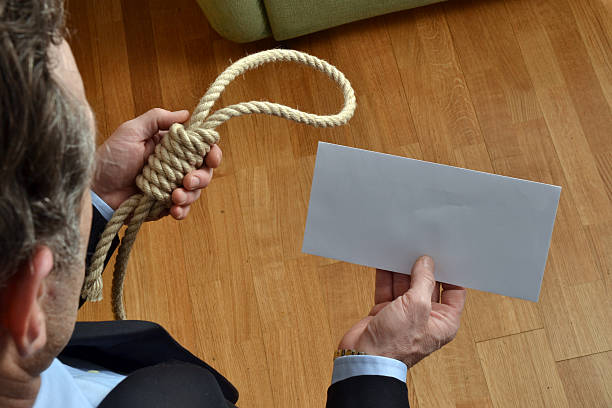 The hangman. Hangman holding a white chart and letter message. wrongful death stock pictures, royalty-free photos & images