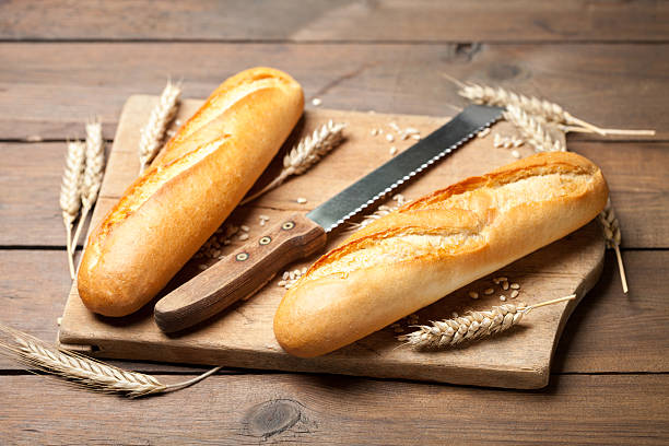 istock Baguettes with knife and cutting board 483918578