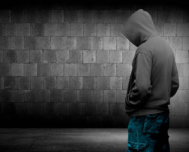 Computer hacker silhouette of hooded man Computer hacker silhouette of hooded man. Threat of your security child crimes stock pictures, royalty-free photos & images