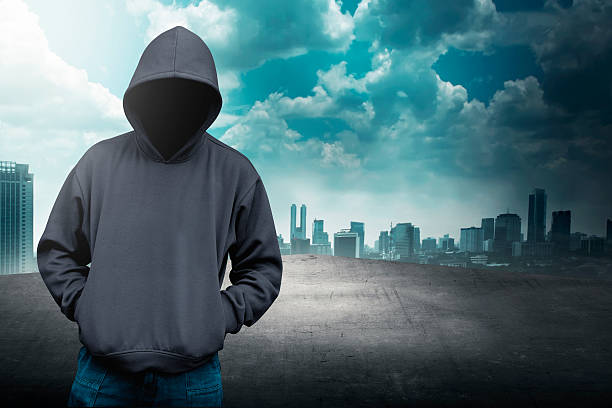 istock Faceless man in hood on the rooftop 483919308