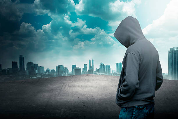 istock Faceless man in hood on the rooftop 483919310