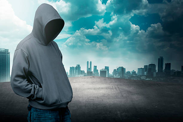 istock Faceless man in hood on the rooftop 483919320
