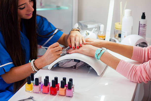 Woman hand on manicure treatment in beauty salon. stock photo