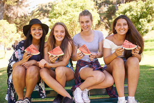Shot of teenage girls eating watermelon outsidehttp://195.154.178.81/DATA/i_collage/pu/shoots/805405.jpg