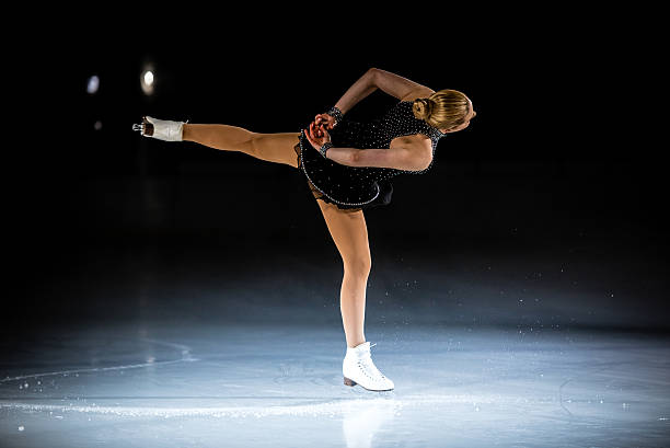 istock Young female figure skater performing 483923880