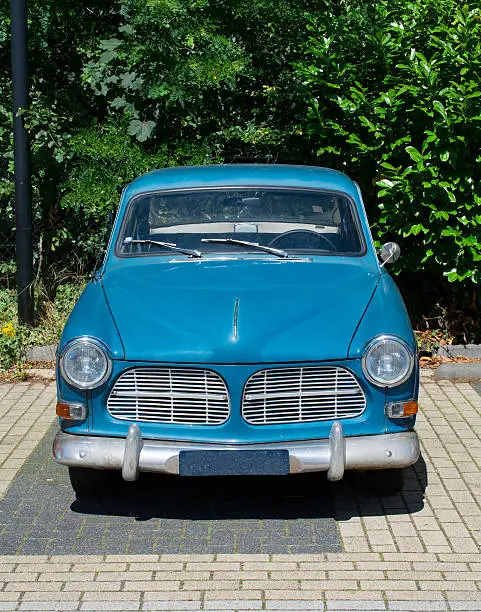 old blue car  in the sun