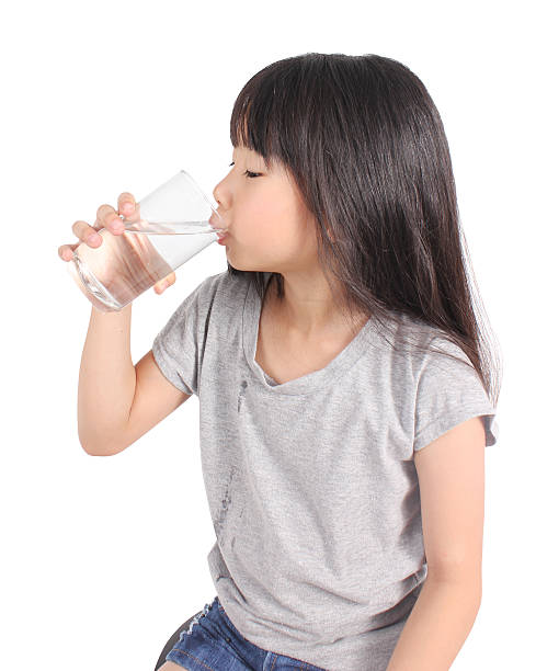 istock Young little girl drinking water. 483924858